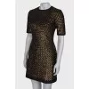 Dress is decorated with sequins