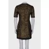 Dress is decorated with sequins