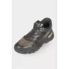 Black sneakers with golden rhinestones