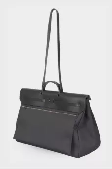 Travel bag with leather flap
