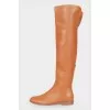 Low-heeled leather over the knee boots