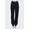 Jeans with a hemmed hem, with a tag
