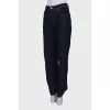 Jeans with a hemmed hem, with a tag