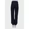 Jeans with a hemmed hem, with a tag