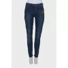 Navy blue jeans with a patch