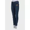 Navy blue jeans with a patch