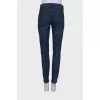 Navy blue jeans with a patch