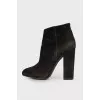Black suede heeled ankle boots