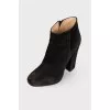 Black suede heeled ankle boots