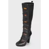 Leather boots with decorative clasp