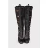 Leather boots with decorative clasp