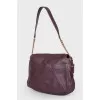Purple bag with gold hardware