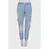 Ripped-effect elasticated jeans