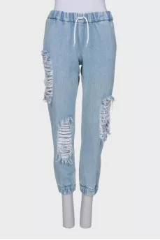 Ripped-effect elasticated jeans