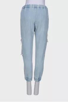 Ripped-effect elasticated jeans