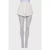White shorts with buttons