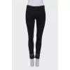 Black jeans embellished at the bottom