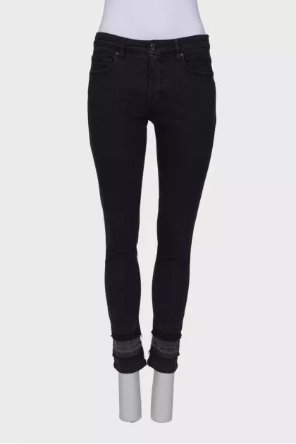 Black jeans embellished at the bottom
