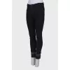 Black jeans embellished at the bottom