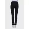 Black jeans embellished at the bottom
