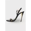 Lacquered sandals with golden hardware