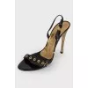 Lacquered sandals with golden hardware