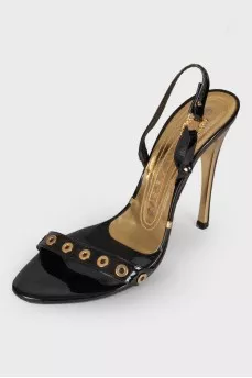Lacquered sandals with golden hardware