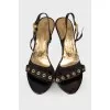 Lacquered sandals with golden hardware