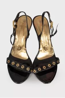 Lacquered sandals with golden hardware