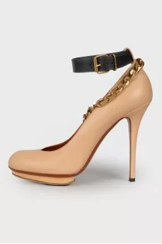Beige shoes with gold hardware