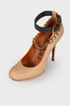 Beige shoes with gold hardware