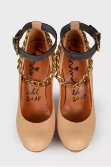 Beige shoes with gold hardware