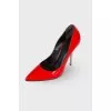 Red leather pumps