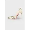 Pumps with snakeskin effect print