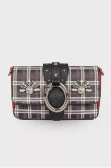 Bag in a cage with a wide strap