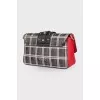 Bag in a cage with a wide strap