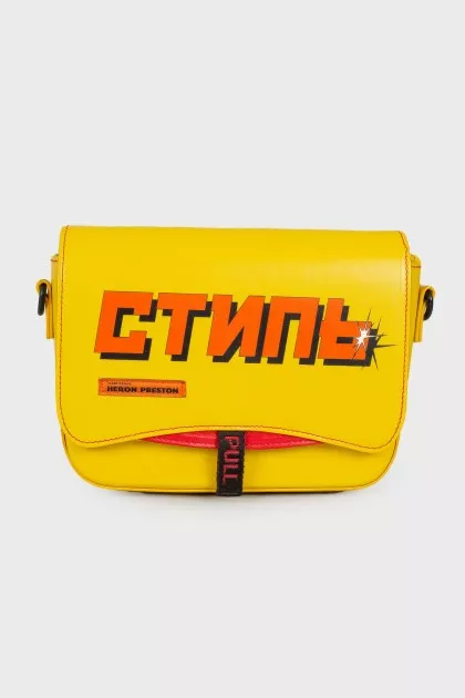 Yellow bag with textile strap