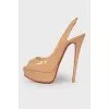 Open heel patent leather shoes