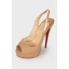 Open heel patent leather shoes