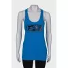 Blue T-shirt with sequins, with a tag
