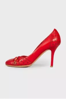 Red perforated shoes