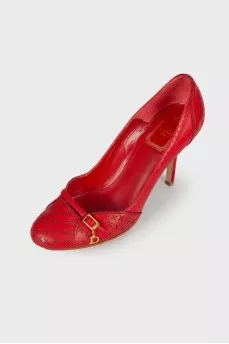Red perforated shoes