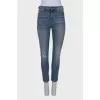 Light blue jeans with distressed patch