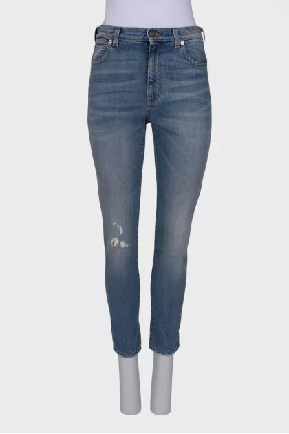 Light blue jeans with distressed patch