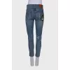 Light blue jeans with distressed patch