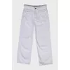 White jeans with a decorative belt