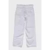 White jeans with a decorative belt