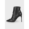Leather ankle boots decorated with rhinestones
