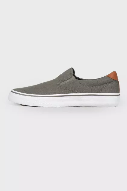 Textile slip-ons with branded embroidery