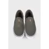 Textile slip-ons with branded embroidery